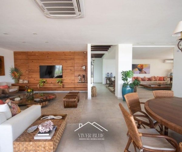Sala de estar ampla com integração total, decoração contemporânea e ambiente aconchegante.