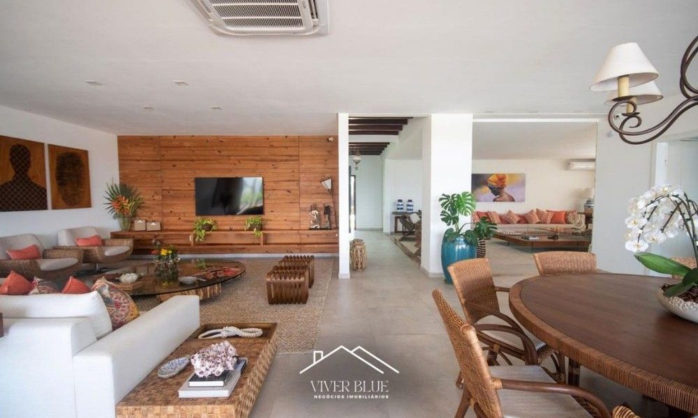 Sala de estar ampla com integração total, decoração contemporânea e ambiente aconchegante.