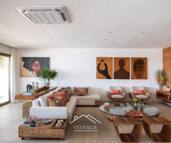 Sala de estar integrada com decoração contemporânea, móveis de design e ambiente amplo e iluminado.