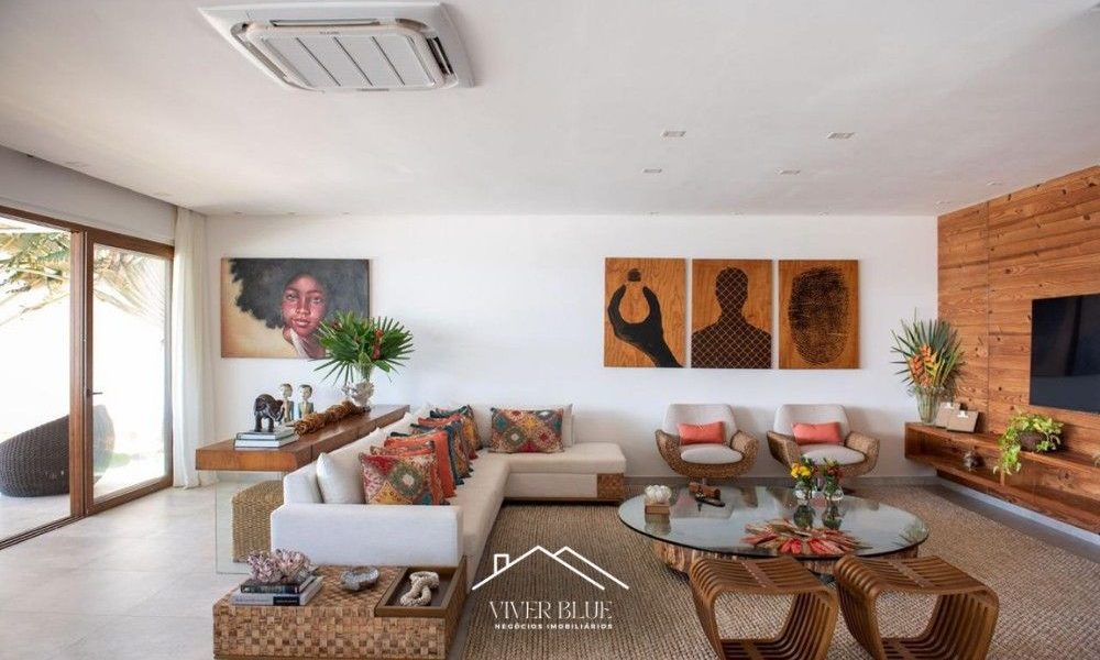 Sala de estar integrada com decoração contemporânea, móveis de design e ambiente amplo e iluminado.